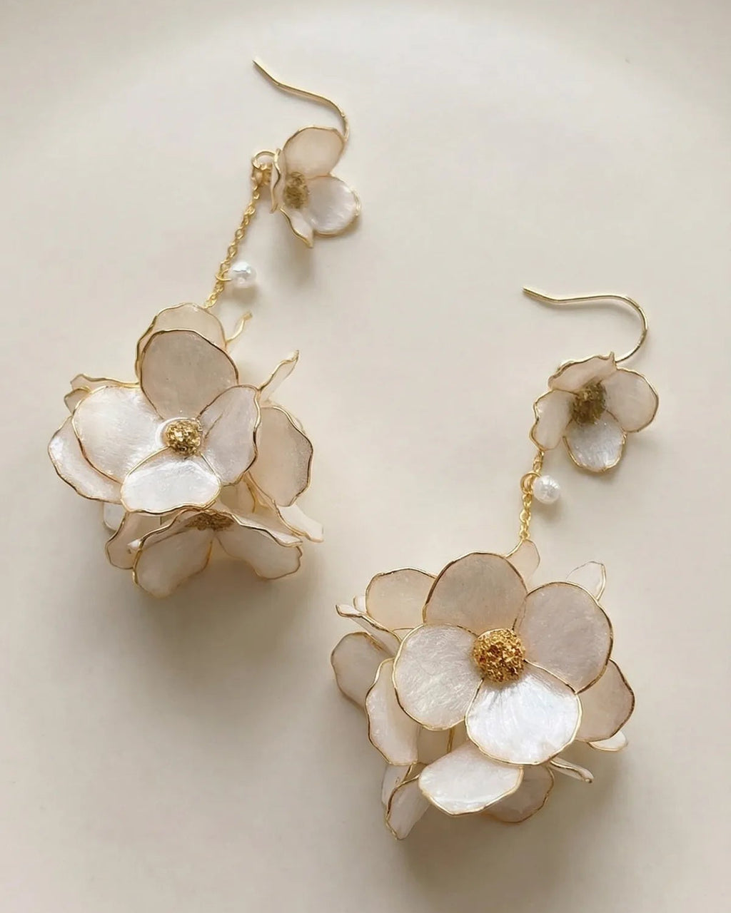 Sparkling Made large flower dangle earrings with pearl shine shown in a clean neutral setting