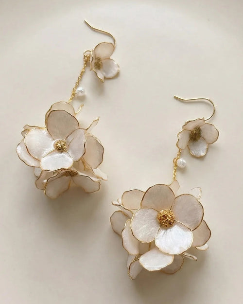 Sparkling Made large flower dangle earrings with pearl shine shown in a clean neutral setting
