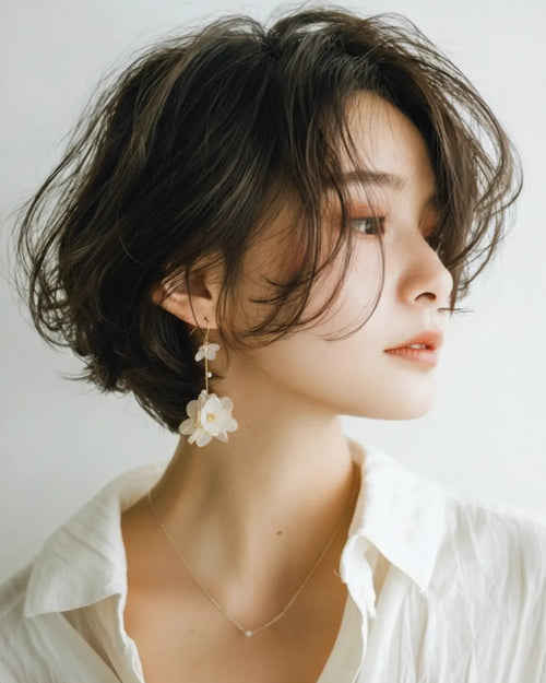 Sparkling Made large flower dangle earrings with pearl shine worn by model, statement floral style with elegant movement